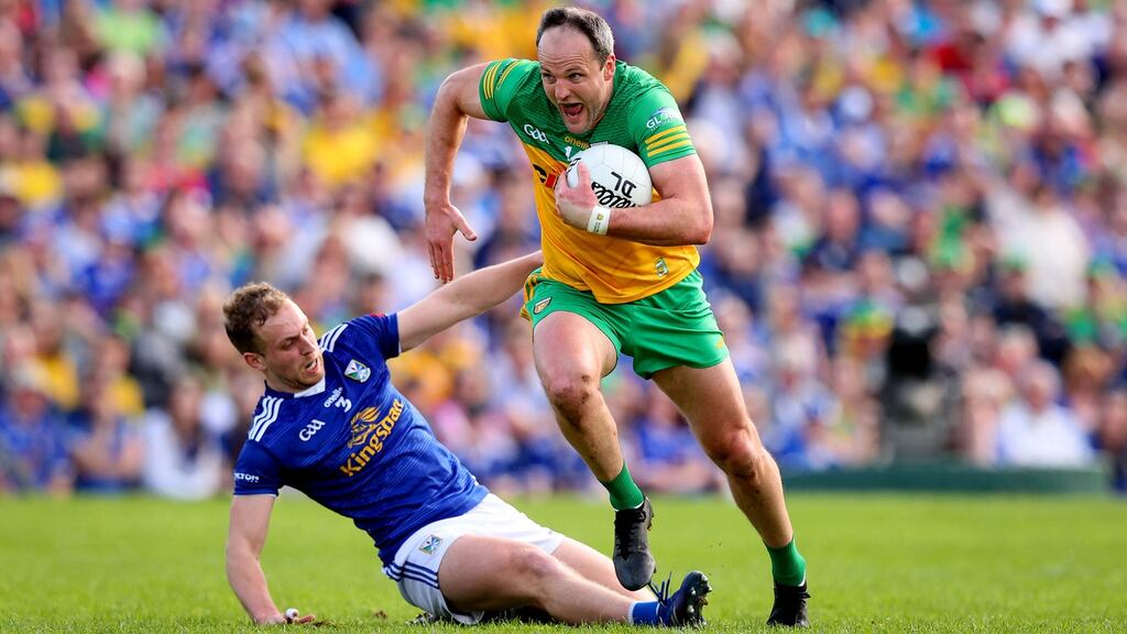Donegal’s Michael Murphy goes past Cavan’s Pádraig Faulkner during the Ulster SFC semi-final at St Tiernach’s Park in Clones. Photograph: Ryan Byrne/Inpho