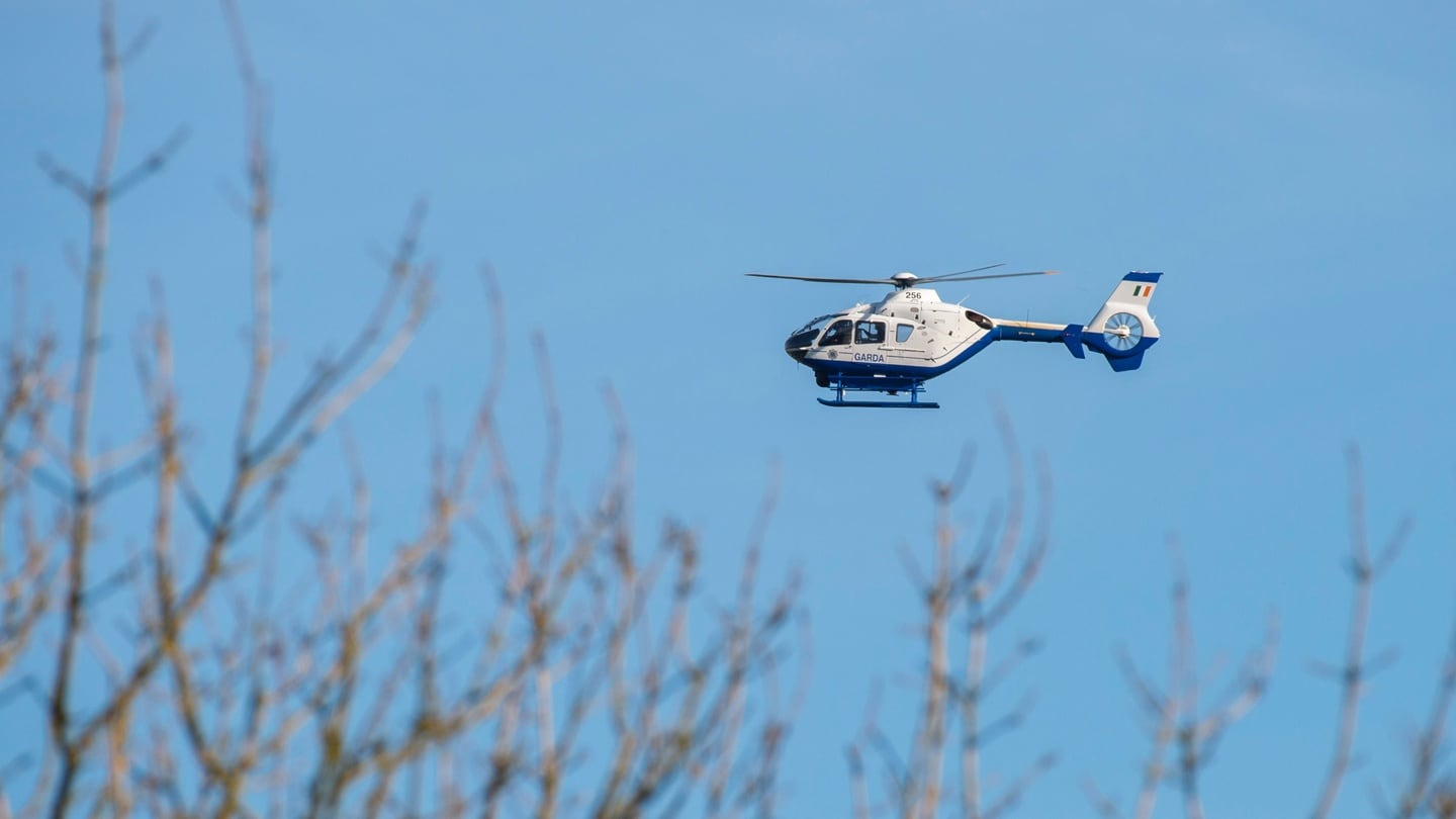 Garda helicopter pictured over the farm in north Cork where the bodies of the two brothers were discovered. The body of a third man was found in a river nearby. Photograph: Daragh Mc Sweeney/Provision