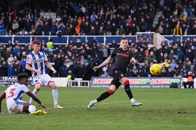Liam Delap of Stoke City looks to shoot as Rollin Menayese of Hartlepool United scores an own goal. Photograph: Stu Forster/Getty Images