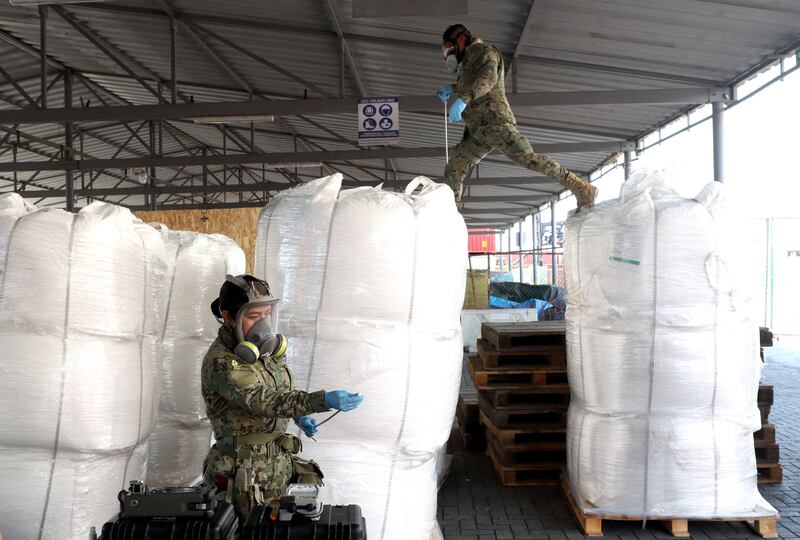 Members of the Mexican navy check suspicious shipments at the pre-inspection area of the SSA precint for detection of illicit substances in Manzanillo, Colima state, Mexico on July 19th. Photograph: Ulises Ruiz/AFP via Getty Images