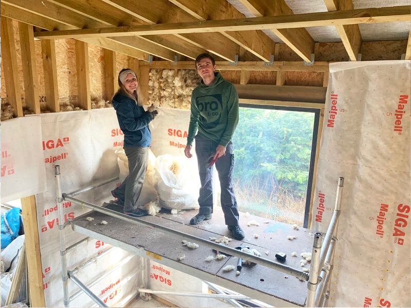 Zag and Francois working on wool insulation