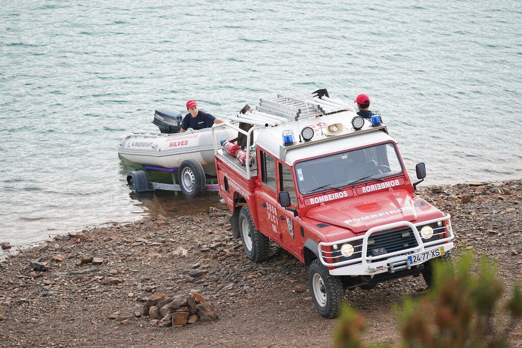 Personnel at Barragem do Arade reservoir, in the Algave, Portugal, as searches begin as part of the investigation into the disappearance of Madeleine McCann. The area is about 50km from Praia da Luz where she went missing in 2007. Photograph: Yui Mok/PA Wire