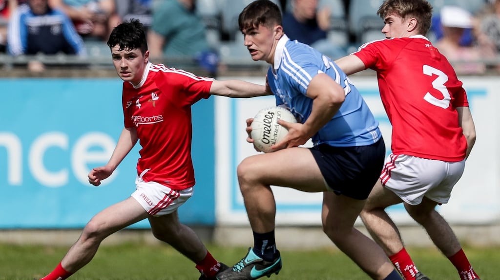 Dublin’s Luke Swan with Tom Jackson and Paul McEvoy of Louth in the Electric Ireland Leinster Minor Football Championship Round 1 at Parnell Park in Dublin. Photograph: Laszlo Geczo/Inpho