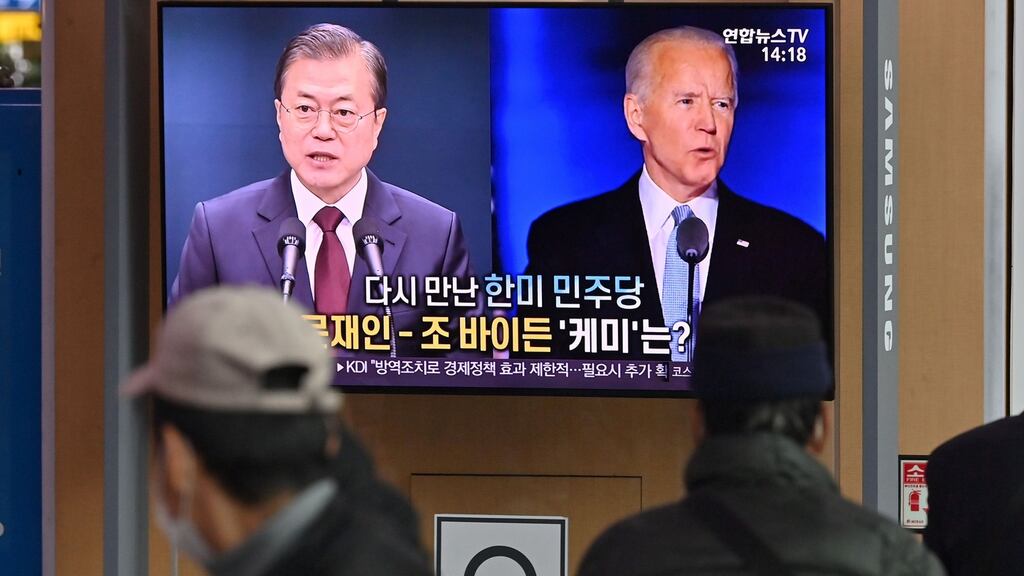 A television news programme reporting on the US presidential election showing images of US President-elect Joe Biden (R) and South Korean President Moon Jae-in (L), at a railway station in Seoul on Monday. Photograph: Jung Yeon-je / AFP