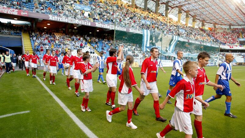 Shels walk out alongside Deportivo La Coruna for their Champions League third qualifying round clash in 2004. Photo: Morgan Treacy/Inpho