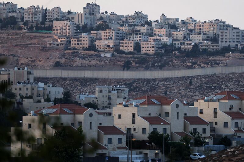 The Israeli settlement of Neve Yaakov in the northern area of east Jerusalem is separated from the Palestinian neighbourhood of al-Ram further up the hill in the occupied West Bank. Photograph: Ahmad Gharabli/AFP via Getty
