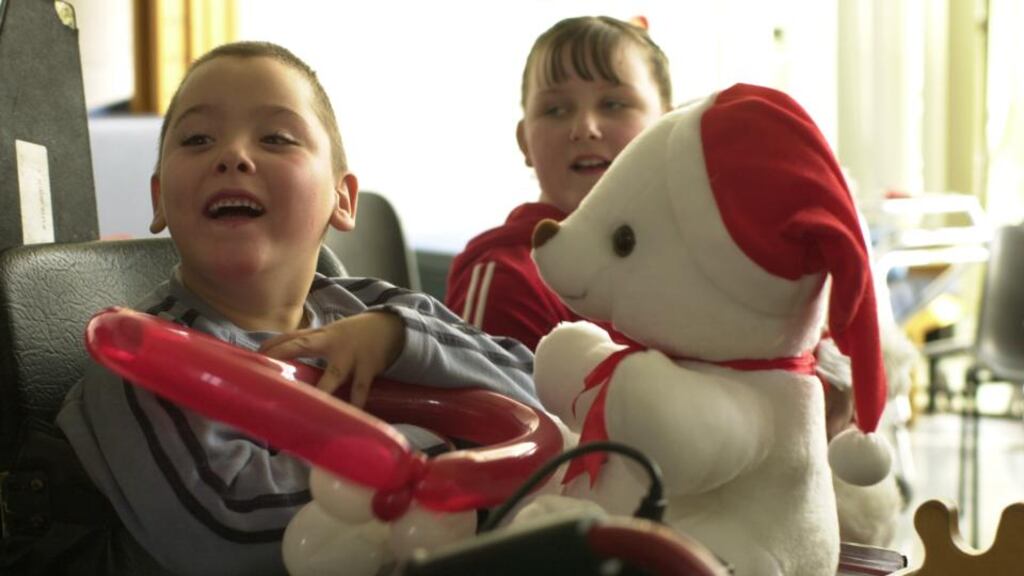 Pupil Kevin Keegan with a ‘Santa Bear’ at the Central Remedial Clinic School in Dublin. Photograph: Frank Miller/Irish Times