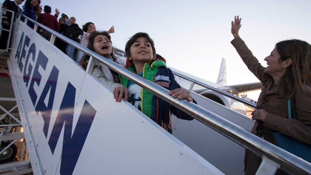 A handout photograph  shows refugees boarding an airplane for their departure for Luxembourg, at  Athens International Airport, in Greece on Wednesday. Photograph: Andrea Bonetti/EPA