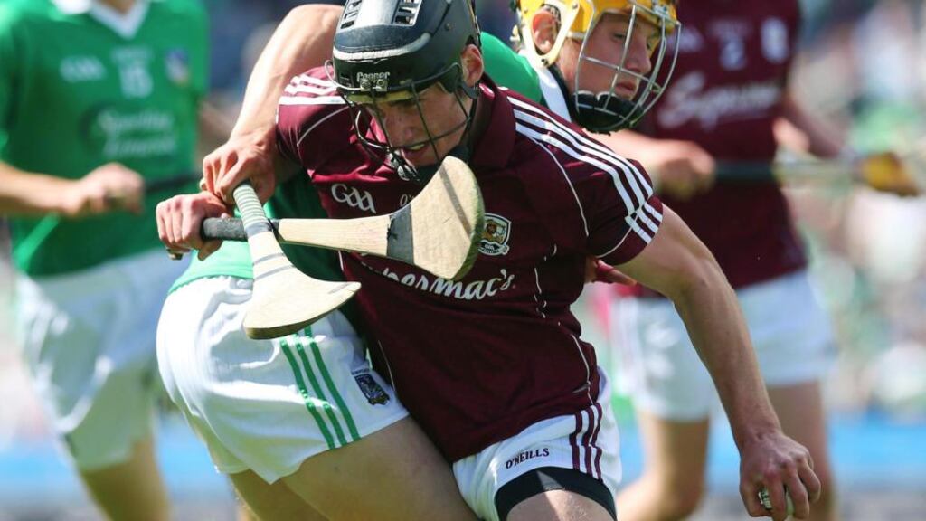 Limerick’s Tom Morrissey attempts to stop the run of Darragh O’Donoghue