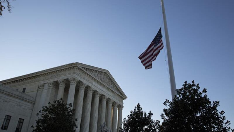 Supreme court flag at half mast following the death of conservative judge Antonin Scalia, which left a crucial swing seat in the balance. Photograph: Drew Angerer/Getty Images