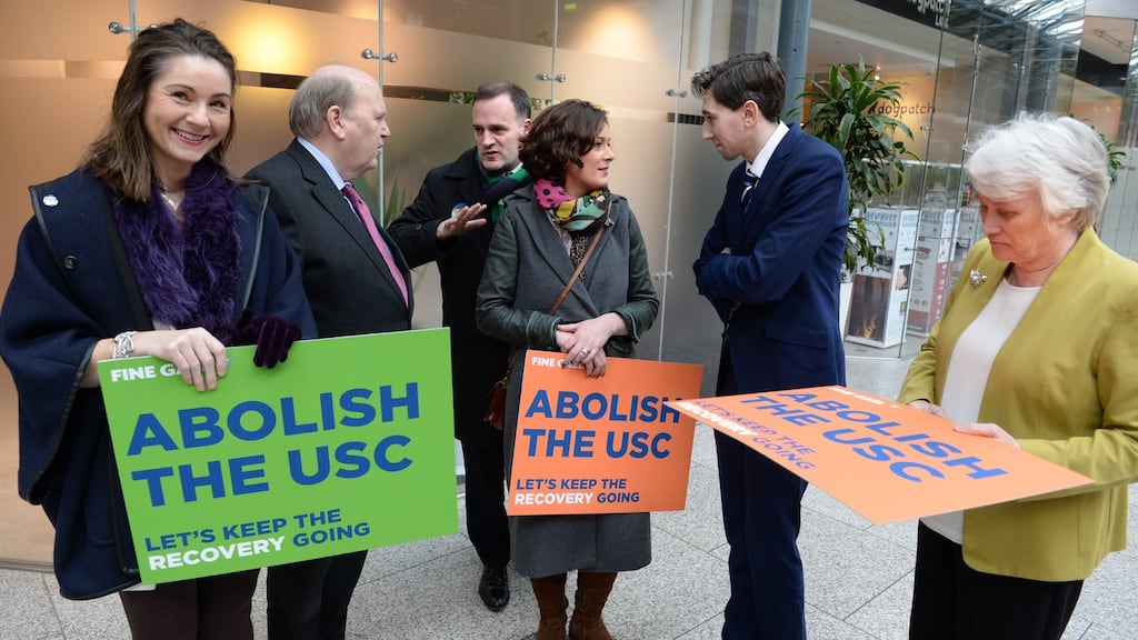 Former minister for finance Michael Noonan in 2016 with Simon Harris and Dublin Fine Gael candidates Anne-Marie Dermody, Naoise Ó Muiri, Kate O Connell and Catherine Byrne, announcing plans to abolish the USC by 2020.