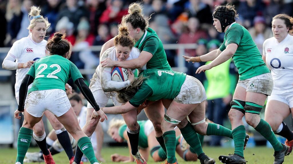 England’s Amber Reed is tackled by Edel McMahon and Victoria Dabanovich O’Mahony of Ireland during the Six Nations game at Castle Park in Doncaster on February 23rd. Photograph: Laszlo Geczo/Inpho