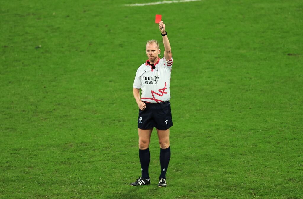 Referee Waynes Barnes upgrades Sam Cane of New Zealand's yellow card to a red card during the 2023 Rugby World Cup Final. Photograph: Billy Stickland/©INPHO