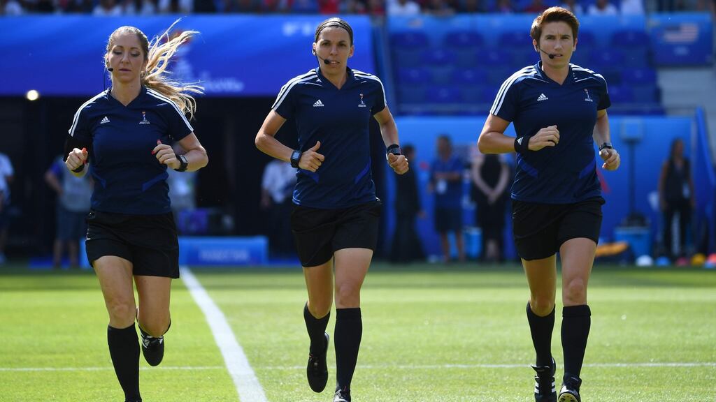 Michelle O’Neill (right) warms up with match referee Stephanie Frappart (centre) and Manuela Nicolosi (left) prior to the Women’s World Cup football final between the USA and the Netherlands. Photograph: Getty Images