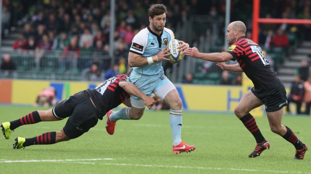 Ben Foden of Northampton is tackled by Schalk Brits (left) and Charlie Hodgson during the Aviva Premiership semi final match between Saracens and Northampton Saints at Allianz Park. Photograph: David Rogers/Getty Images