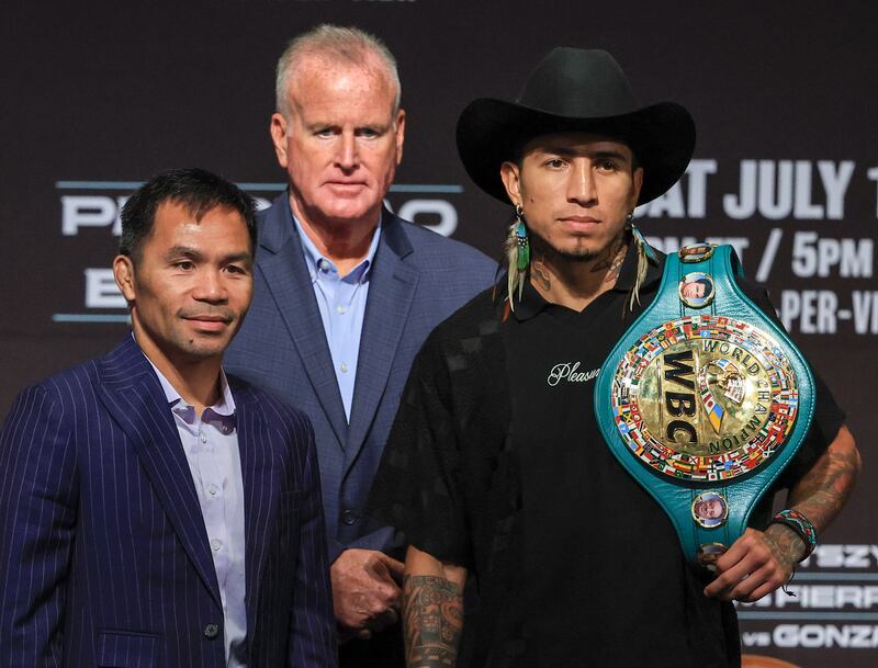 TGB Promotions president Tom Brown (middle) looks on as Manny Pacquiao (left) and WBC welterweight champion Mario Barrios pose ahead of their fight at the MGM Grand Garden Arena in Las Vegas. Photograph: Ethan Miller/Getty Images