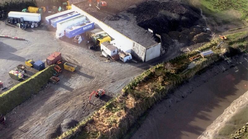 Jim Ferry’s illegal waste dump at Rossbracken, near Letterkenny in Co Donegal, on the banks of the Isle Burn river of the Lough Swilly Special Area of Conservation. Behind the retaining wall is some of the estimated 14,000 tons of illegally dumped waste which is being covered over by a soil-spreading digger