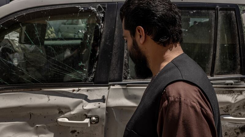 Rahmatullah Yarmal, governor of Laghman Province, beside the armoured Land Cruiser he was riding in when he was attacked by a suicide car bomber last October. Photograph: Jim Huylebroek/The New York Times