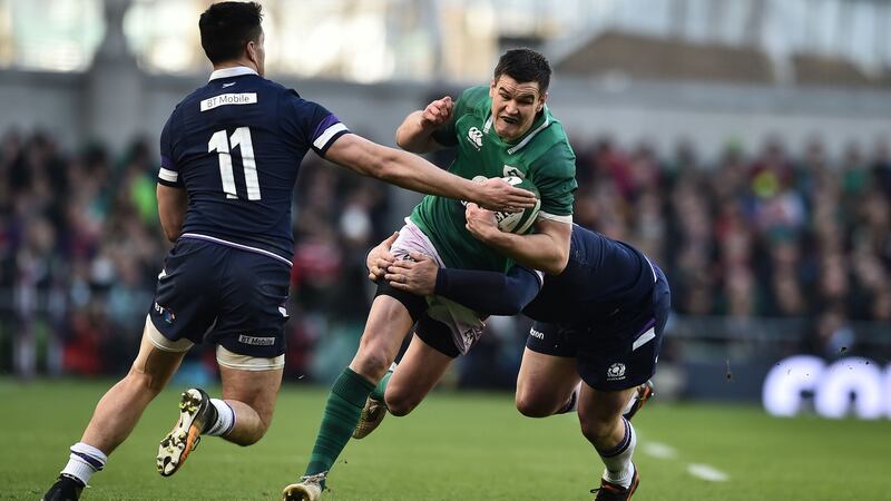 Johnny Sexton of Ireland is tackled by Sean Maitland and WP Nel of Scotland during the Six Nations match at the Aviva Stadium. Photograph: Charles McQuillan/Getty Images