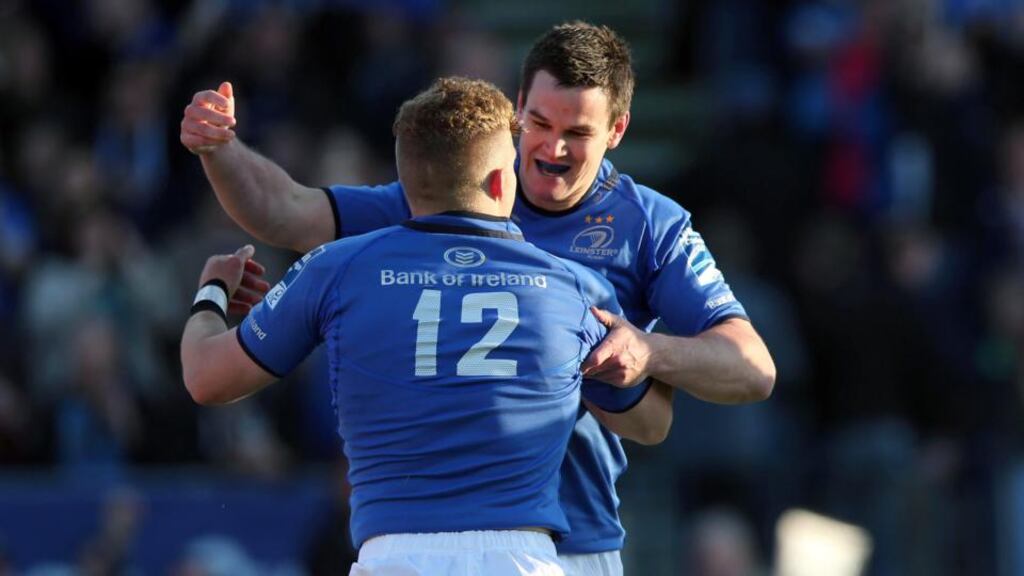 Leinster’s Ian Madigan celebrates his try with outgoing outhalf Jonny Sexton.  Photograph: Dan Sheridan/Inpho
