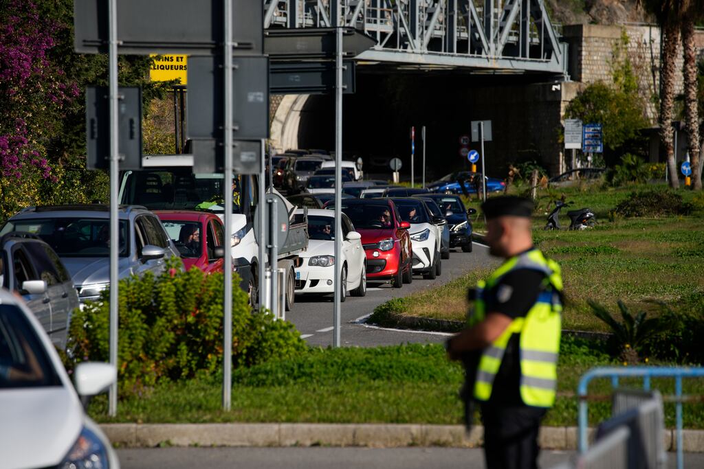 Cars line up for police checks before entering France from Italy at a border crossing in Menton, southern France. Photograph: Daniel Cole/AP/PA