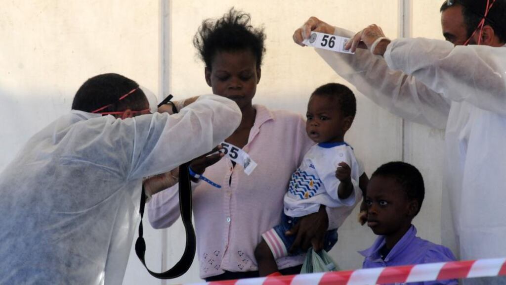 A family is identified as they disembark from LÉ Niamh at the Palermo harbour in Sicily, Italy. Photograph: Alessandro Fucarini /AP Photo