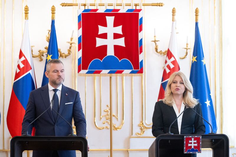 Slovakian president-elect Peter Pellegrini and outgoing resident Zuzana Caputová. Photograph: Vladimir Smicek/AFP via Getty Images