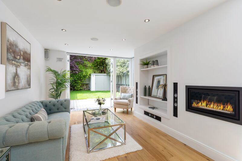 Family room with double doors leading to garden