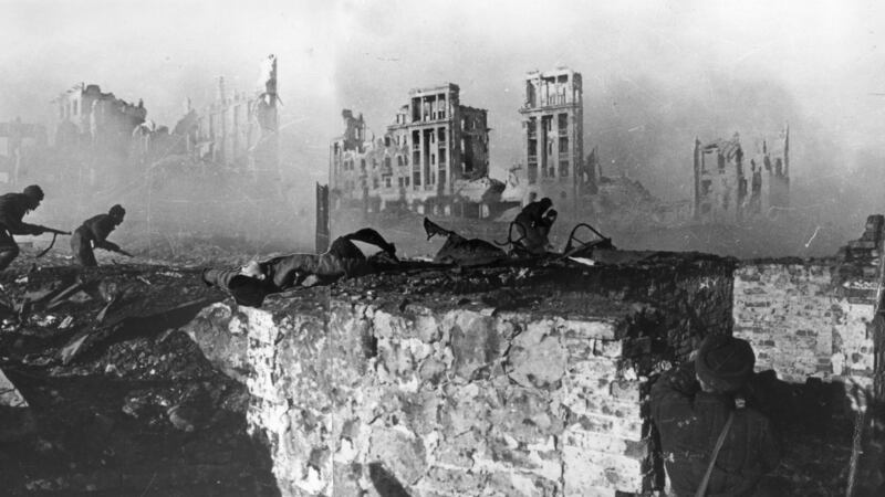 1942: Red Army troops storming an apartment block amidst the ruins of war-torn Stalingrad. This is a composite image. Photograph: Georgi Zelma/Slava Katamidze Collection/Getty Images