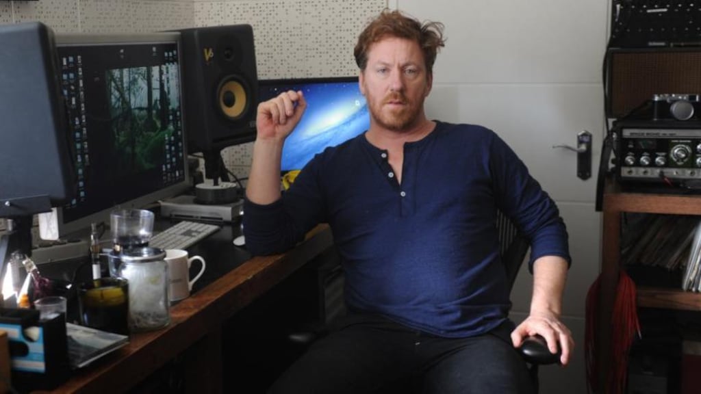 David Holmes in his studio: ‘I’ve always loved living in Belfast; with my DJing career I’ve travelled all round the world, but I always wanted to come back.’ Photograph: Colm Lenaghan/Pacemaker