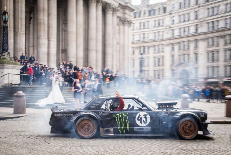 Top Gear host Matt LeBlanc waving to a bride and groom and their wedding guests at St Paul's Cathedral in London as he went past with rally driver Ken Block. Photograph: Ron Zaras/Zoonigan Racing/PA Media