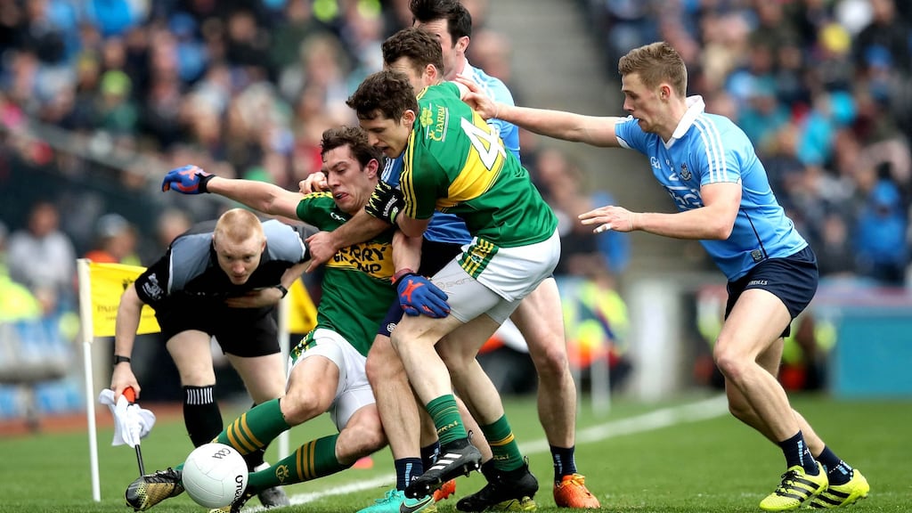 Dublin’s Michael Darragh McAuley and Paul Mannion in action against Kerry’s Ronan Shanahan and David Moran last April. Dublin get their season under way against Kildare in Croke Park tonight. Photograph: Ryan Byrne/Inpho