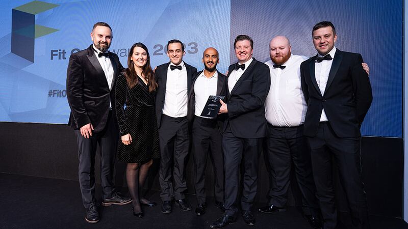 Mark Dunne, senior director at Globoserv, presents the fit out professional consultancy of the year award to the Ethos Engineering team