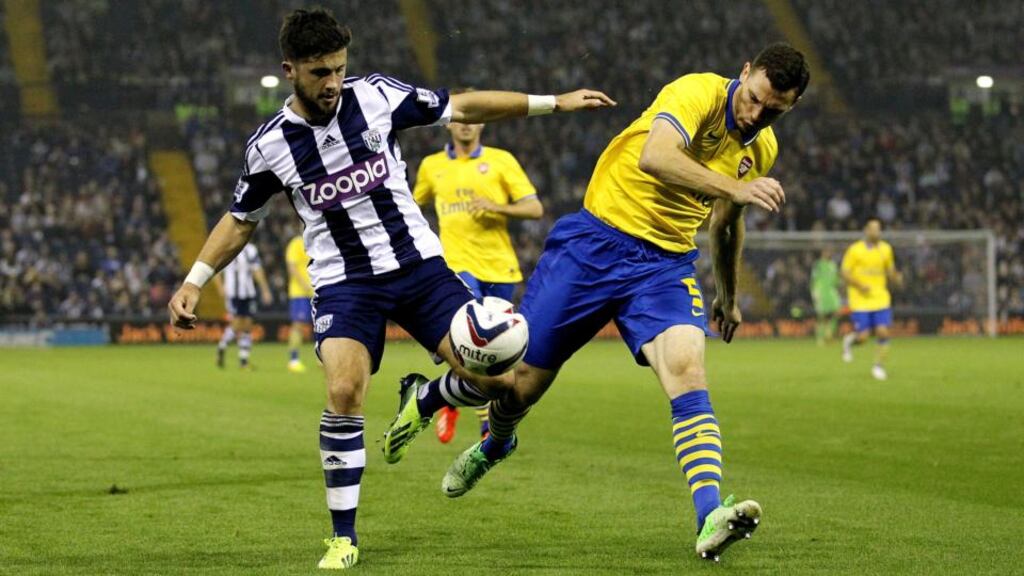 West Bromwich Albion’s Shane Long is challenged by Arsenal’s Thomas Vermaelen during the Capital One Cup, third round match at The Hawthorns. Photograph: David Davies/PA