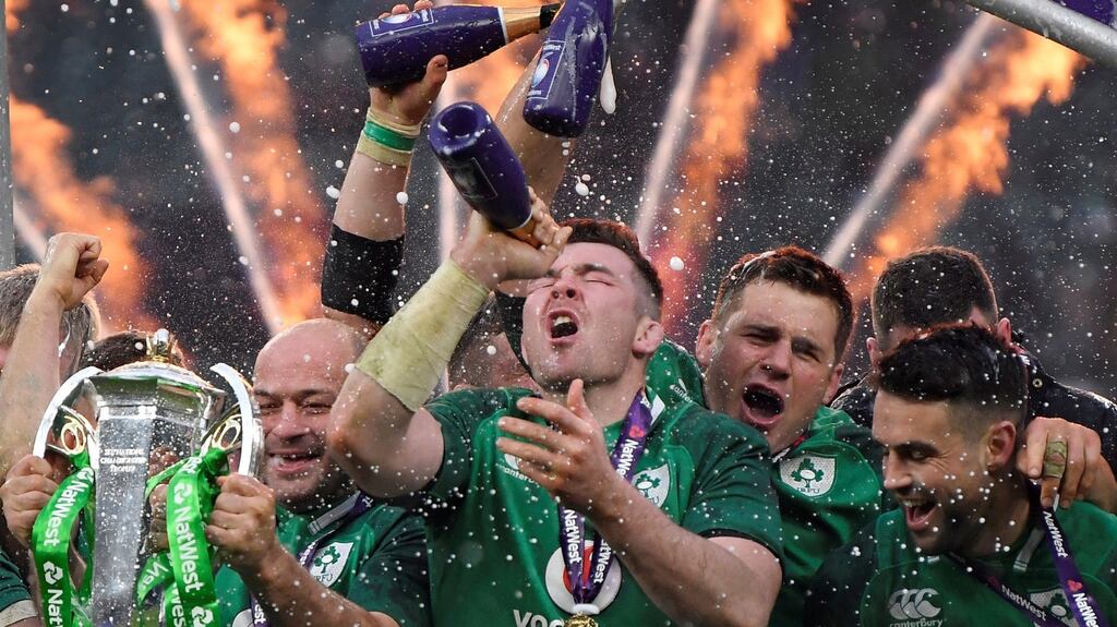 Ireland’s Rory Best, Peter O’Mahony and team mates celebrate with the Six Nations trophy during the presentation at the end of the match. Photo: Toby Melville/Reuters