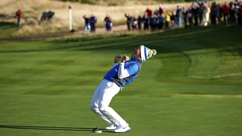 Suzann Pettersen celebrates after her putt on the 18th green secured the Solheim Cup for Europe against the United States at Gleneagles Golf Club in Auchterarder, Scotland. Photograph: Jane Barlow/PA Wire