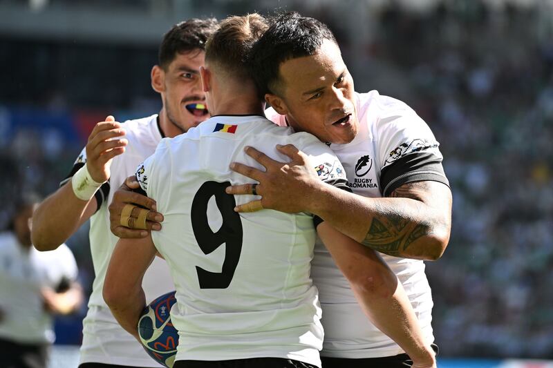 Romania's Gabriel Rupanu celebrates with team-mates after scoring the opening try against Ireland. Photograph: Caroline Blumberg/EPA
