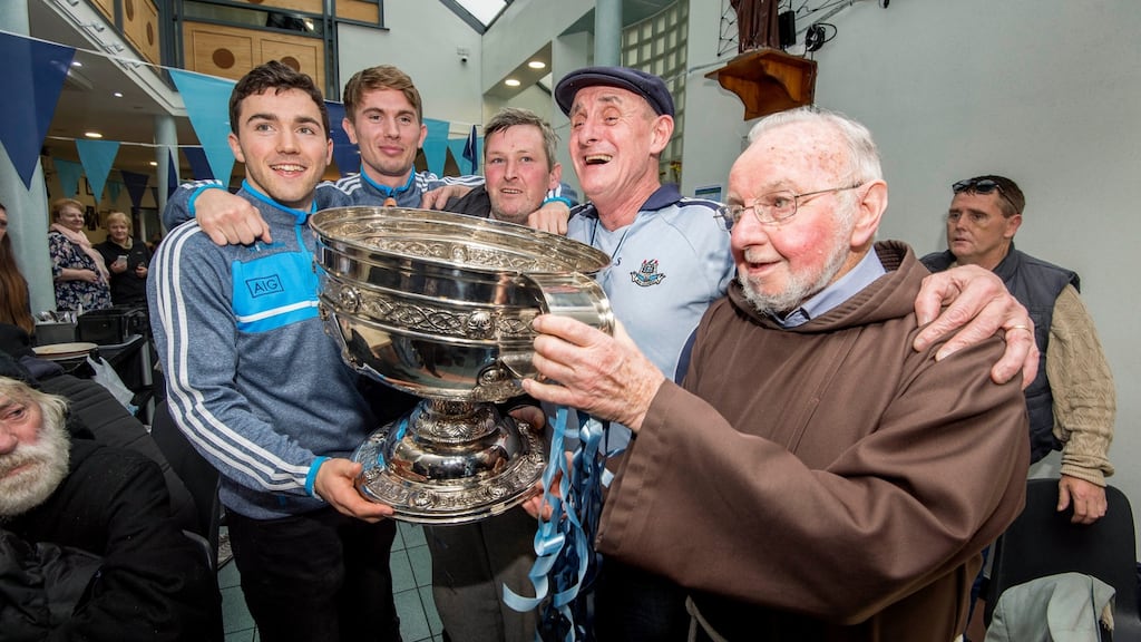 The Sam Maguire at the Capuchin Day Centre in Dublin where All Ireland winners Colm Basquel and Michael Fitzsimons joined Br Kevin Crowley and guests to celebrate Dublin’s three in a row. Photograph: Brenda Fitzsimons