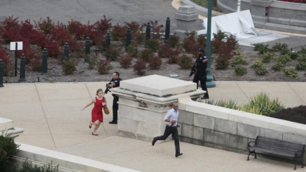 Police close in on the US Capitol as people run for cover after reports of a shooting. The US Capitol and the White House were placed on lockdown. Photograph: Alex Wong/Getty Images