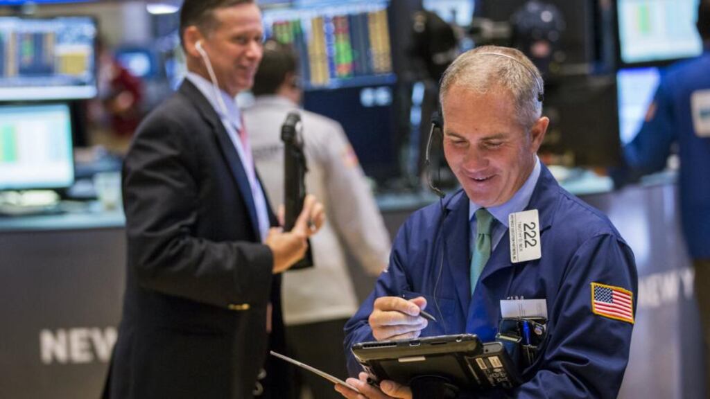 Traders work on the floor of the New York Stock Exchange shortly after the opening of the markets in New York. Wall St was down on concerns over what the Fed will do on rates. Photograph: Lucas Jackson/Reuters