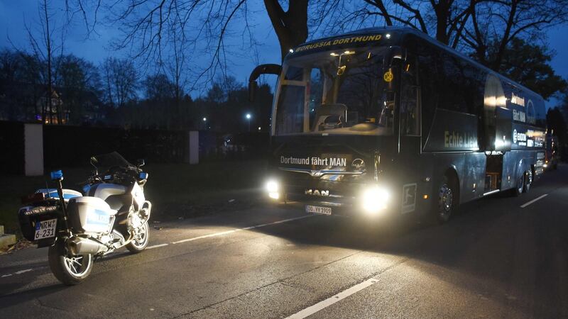 Borussia Dortmund’s damaged bus  after an explosion some 10km from the stadium prior to the Uefa Champions League 1st leg quarter-final between  Borussia Dortmund  and Monaco in Dortmund. Photograph: Patrik Stollarz/AFP/Getty Images