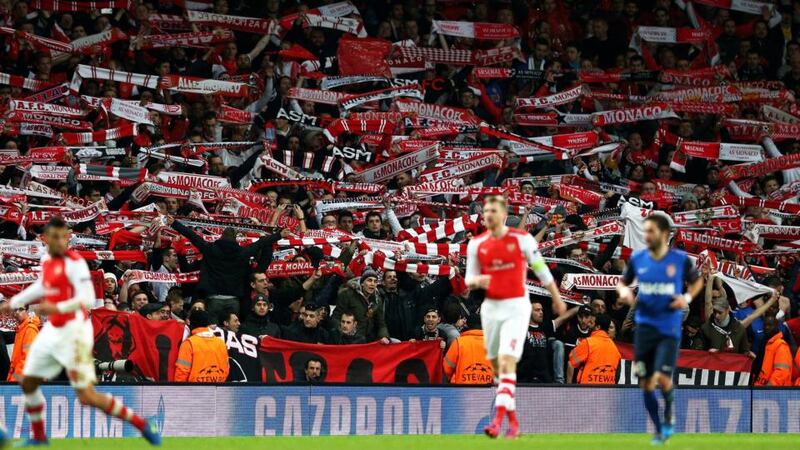 Monaco fans cheer on their team during their 3-1 win at Arsenal. Photo: Clive Mason/Getty Images