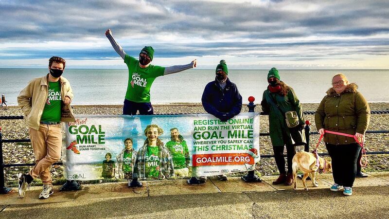 David Wilkins, Mladen and Jelica Ivosevic (from Croatia) and Grace Connor, with labrador Sadie, doing their Goal Mile at Bray Seafront