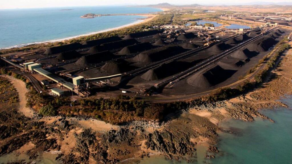 Mounds of coal can be seen along the coastline of Queensland at the port of Hay Point, located around 450 km southeast of the city of Townsville. Australia’s Great Barrier Reef watchdog gave the green light today for millions of cubic metres of dredged mud to be dumped near the fragile reef to create the world’s biggestcoal port. Photograph: Greenpeace/Patrick Hamilton/Handout via Reuters