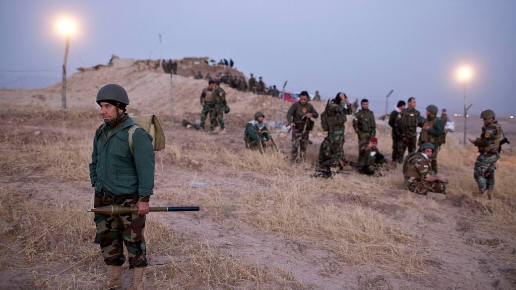 Kurdish Peshmerga forces gather prior to opening up a front against Islamic State in Nawaran, some 20 kilometres northeast of Mosul. Photograph: AP Photo/Marko Drobnjakovic