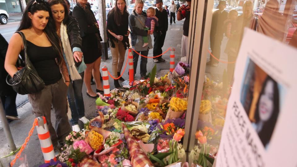 Crowds gather at floral tributes outside the front of the Duchess Boutique on Sydney Rd, the shop which captured the last CCTV footage of Jill Meagher on September 28th, 2012 in Melbourne. Photograph: Scott Barbour/Getty Images