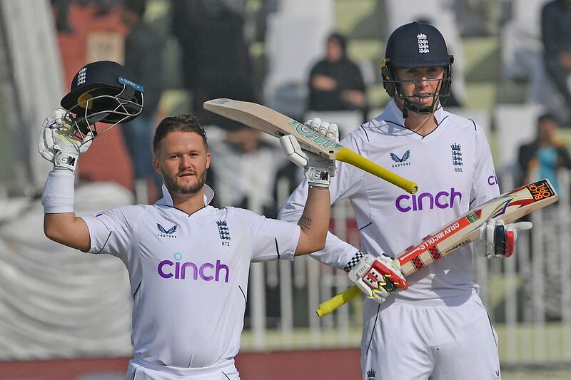 England's Ben Duckett celebrates after scoring a century next to his opening partnerr Zak Crawley, who also scored a century, on the first day of the first Test against Pakistan at the Rawalpindi Cricket Stadium. Photograph: Aamir Qureshi/AFP via Getty Images