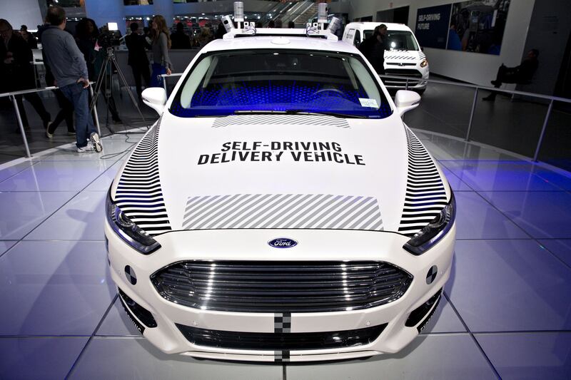A Ford Motor Co Fusion set-up as an experimental self-driving delivery vehicle sits on display during the 2018 North American International Auto Show in Detroit, Michigan January 15th, 2018. Photographer: Daniel Acker/Bloomberg/Getty