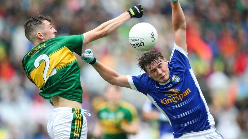 Cavan’s Oisin Pierson under pressure from Sean O’Leary of Kerry. Photograph: Gary Carr/Inpho