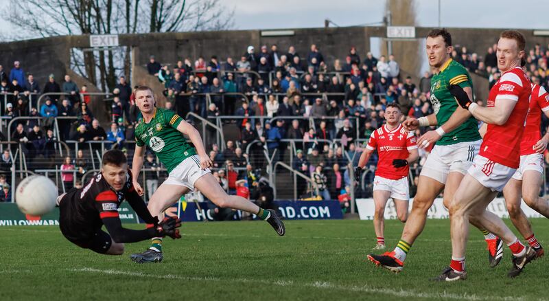 Meath’s Mathew Costello scores his side's goal despite goalkeeper Niall McDonnell of Louth. Photograph: James Crombie/Inpho